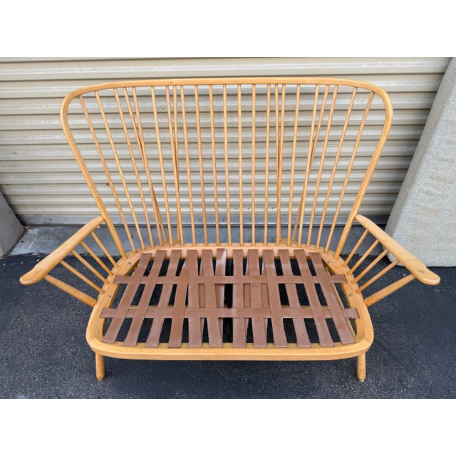 Priced to sell this week – open to serious offers. Beautiful Ercol-style high back settee featuring a sculptural spindle-...