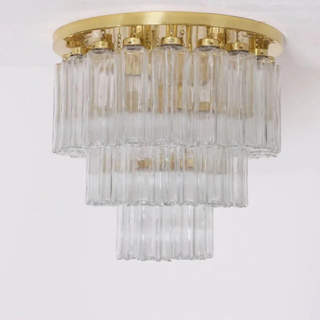 A pair of high quality limburg chandeliers. This pieces are an example of limburg's modernist re-interpreted of the art...