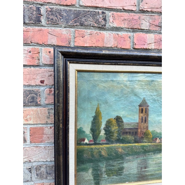 Amazing oil on canvas from Europe, depicting a tranquil misty rural scene with a lovely riverside church. The oil is...