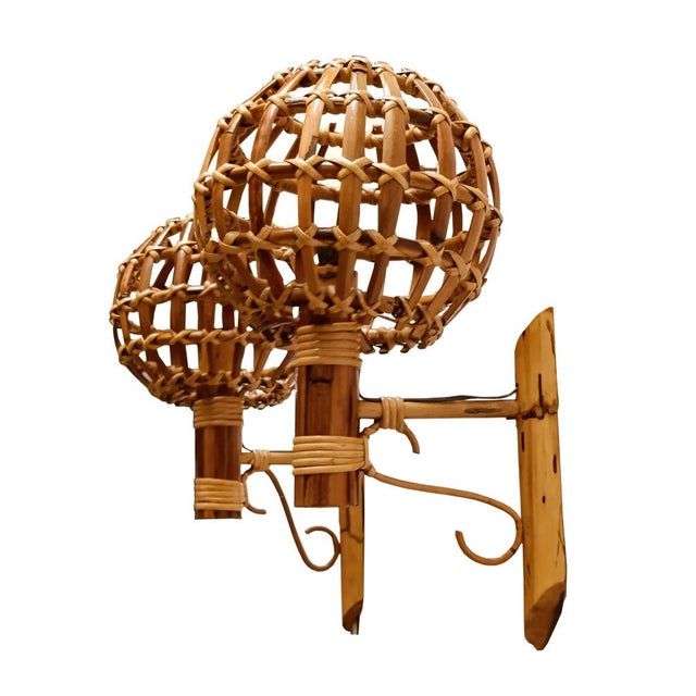 Pair of sconces "Lantern" wall lamps in rattan and bamboo, attrib.to Louis Sognot. Made in France in the 1960s. A...