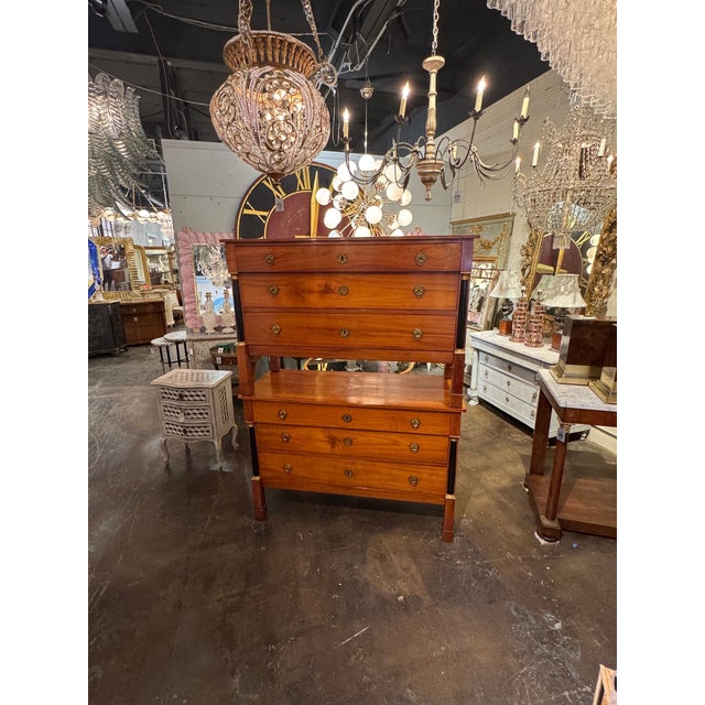 This product is a pair of French Empire walnut commodes. These chests have a classic French Empire design, featuring...