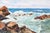 Dynamic and energetic watercolor of waves crashing into coastal rocks by Joe Yeager (American, 20th Century). Signed in...