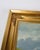 Oil painting framed in a gilded wooden frame with the motif of a cabin out in a mountain landscape. Signed by P. Svarter...