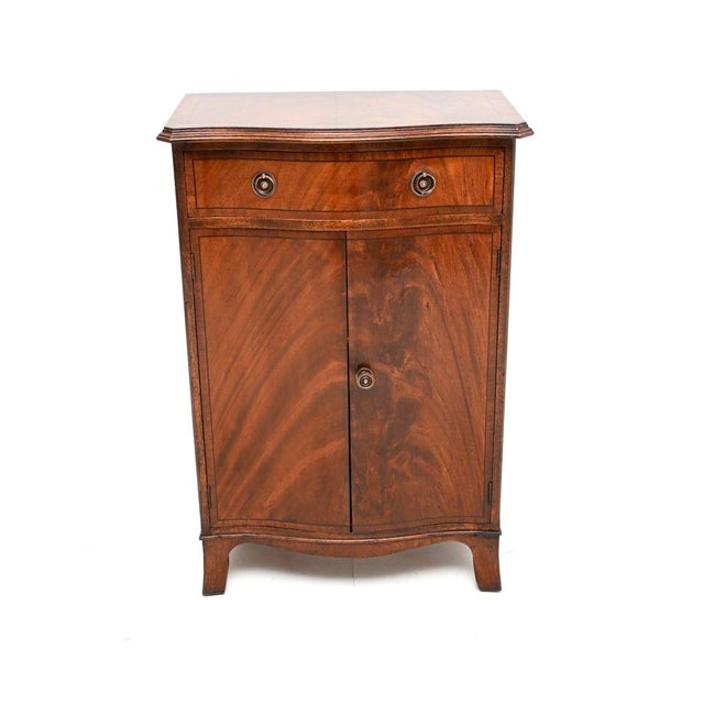 A wonderful antique inlaid side cabinet. This was made in England, it dates from around the 1900-1920 period. It is of...