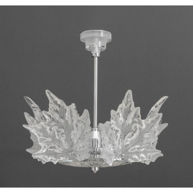 Lalique Champs-Elysees Chandelier, six-lights with molded clear and frosted leaf motif on chrome-plated hexagonal frame,...