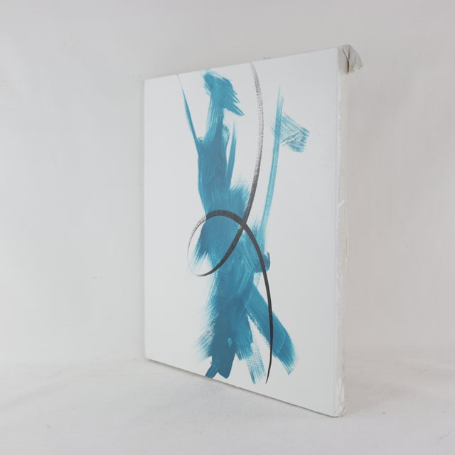 This striking modern art piece captures the essence of fluid movement and gracefulness through bold, energetic...