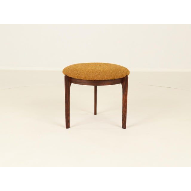 Stool or Footrest in Rosewood from Denmark. Frame in beautiful rosewood, upholstery in orange fabric. Made in Denmark,...