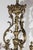Ornate cast brass French chandelier designed circa 1890. This late 19th century piece includes floral glass shades to...