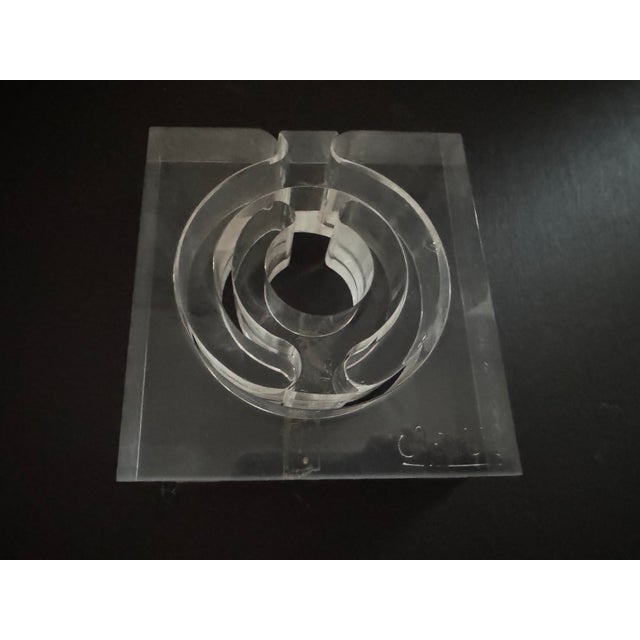 A very cool and unique vintage puzzle/sculpture in lucite. Four interlocking pieces. Signed by artist. Great on a desk or...