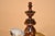 Circa 1800 American walnut tavern pipe stand. The central piece of the stand is elegantly hand turned and has a hand made...