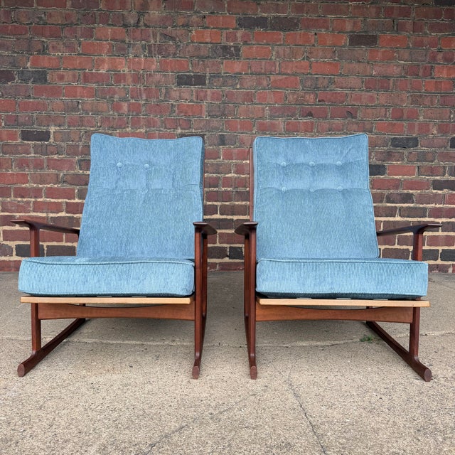 This is a pair of Ib Kofod Larsen for Selig Sled high back lounge chairs. They feature the high lattice back, walnut frame...