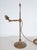 Original Arts and Crafts brass student desk lamp by Faraday and Son, circa 1900, raised on a nicely weighted circular base...