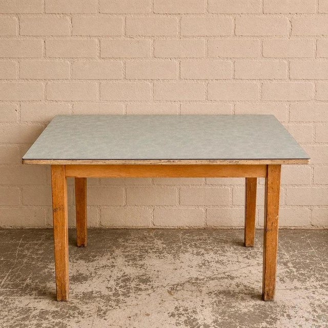 A charming mid-century kitchen or breakfast table with a light blue floral Formica top. Its compact rectangular...