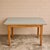 A charming mid-century kitchen or breakfast table with a light blue floral Formica top. Its compact rectangular...