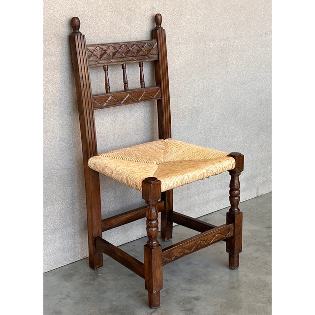 20th century set of six Catalan chairs in carved walnut and caned seats. Country chairs. Dimensions: Height: 36.62 in (93...