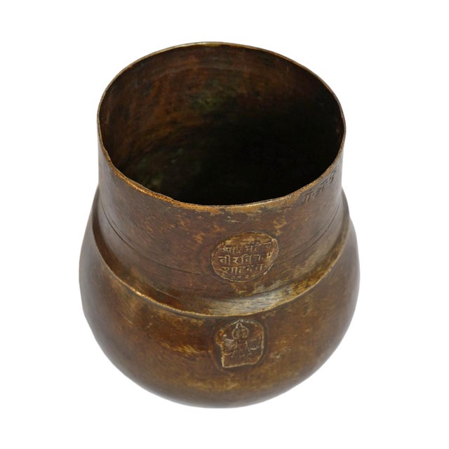 Beautiful old Nepali bronze mana measuring cup, traditionally used as a standardized vessel for measuring grains such as...