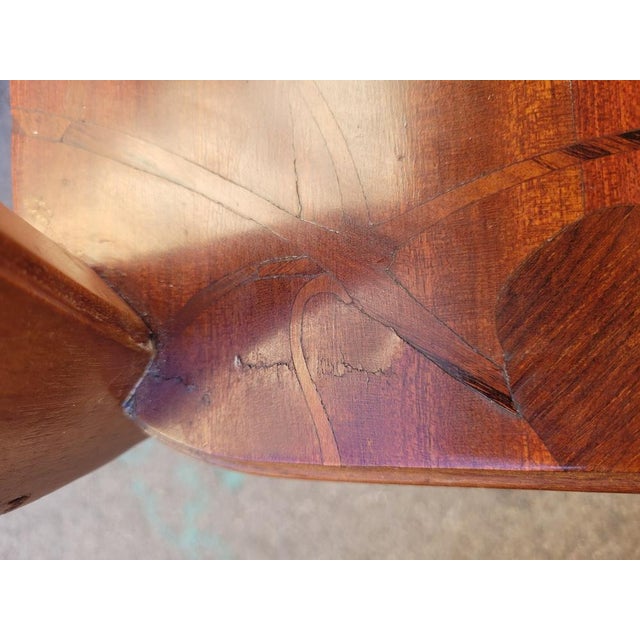 Tea table with 2 trays, in marquetry of different types of wood: the trays are decorated with flowers (clematis) and...