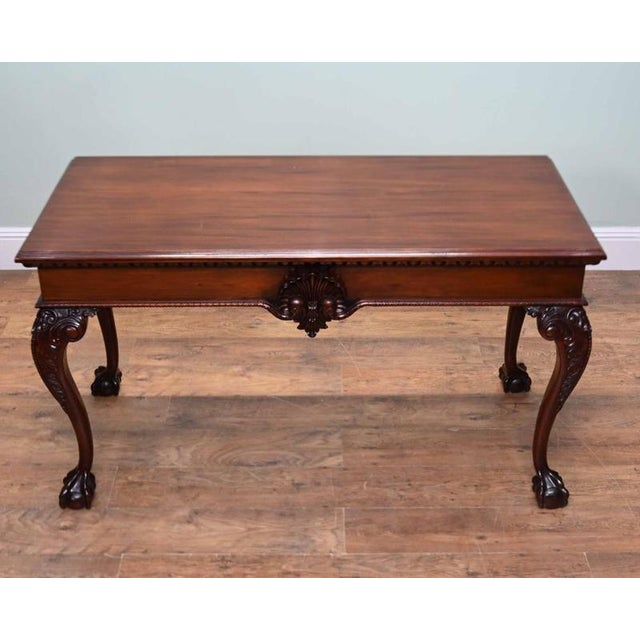WImpressive Chippendale style mahogany console table dating from the early 20th century The rectangular top is set above a...