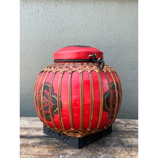 This striking vintage Asian lidded basket is a vibrant celebration of traditional folk craftsmanship and global design....