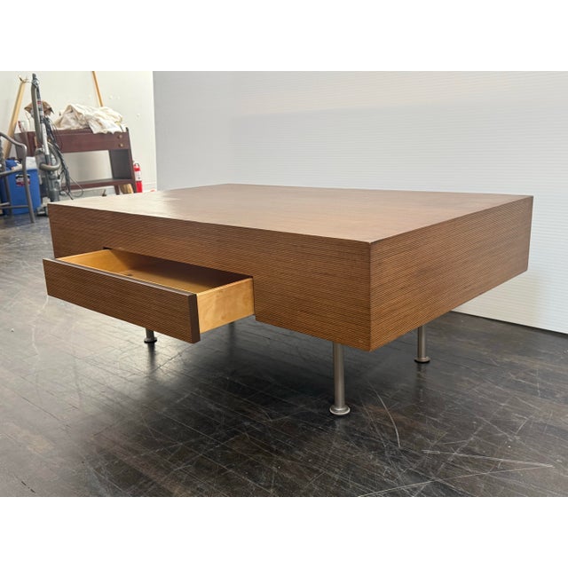 Design Plus Gallery presents a Bespoke Coffee Table + Drawer. This coffee table has a rectangular wood and veneer case...