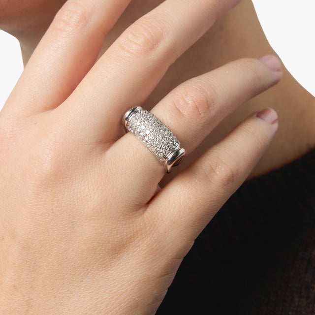 This elegant French vintage pavé ring showcases a seamless surface of shimmering round brilliant diamonds, creating a...