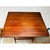 Folding wooden coaching table with curved X-form legs, turned stretcher, and brass hardware. The proportions and folded...