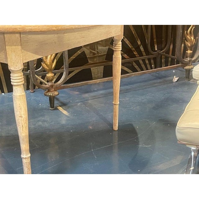 This product is a pair of 19th century Swedish painted demi-lune consoles, which are tables. These consoles reflect the...
