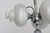 A stunning vintage 7-light chandelier by Boulanger, showcasing the bold, futuristic elegance of 1970s Space Age design....