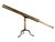 Brass telescope. Low-set metal tripod feet and singular central pillar.