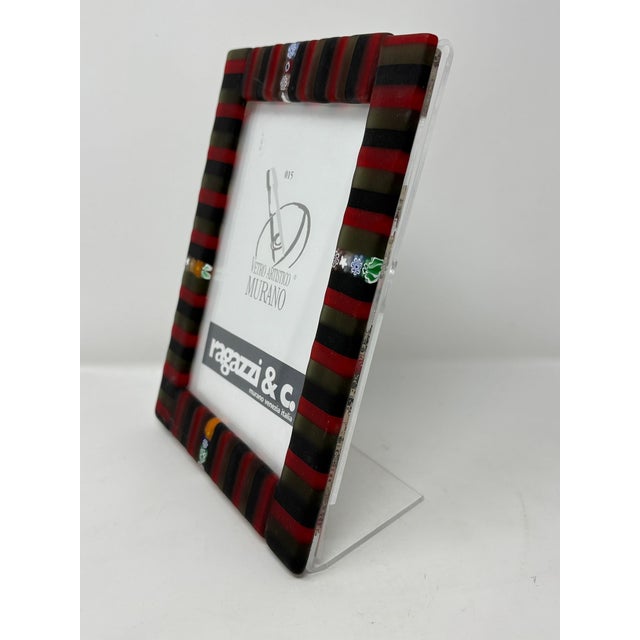 Beautiful Murano Glass picture frame. Brand new. Created by one of the top Artists in Murano. Measures 8" x 6.75".