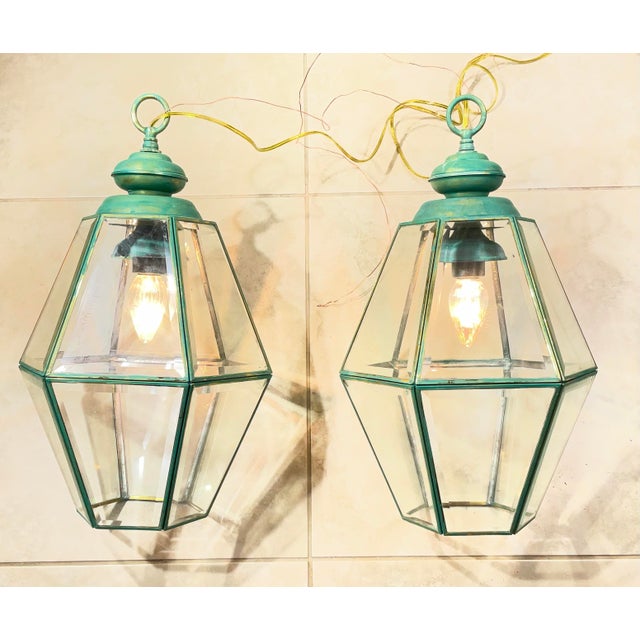exquisite pair of vintage, geometrically-styled hanging lanterns. These fixtures blend timeless elegance with...