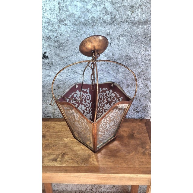 A Napoleon III style hanging lantern, dating from the second half of the 19th century. The wrought iron structure has a...
