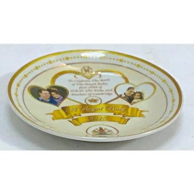 English, porcelain, Royal Baby, commemorative plate from the Joan Rivers Estate. The plate depicts images of the Duke and...
