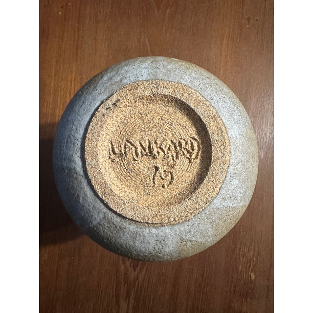 Infuse your home with a piece of 1960s artistry with this studio pottery vase, a signed and numbered creation that...