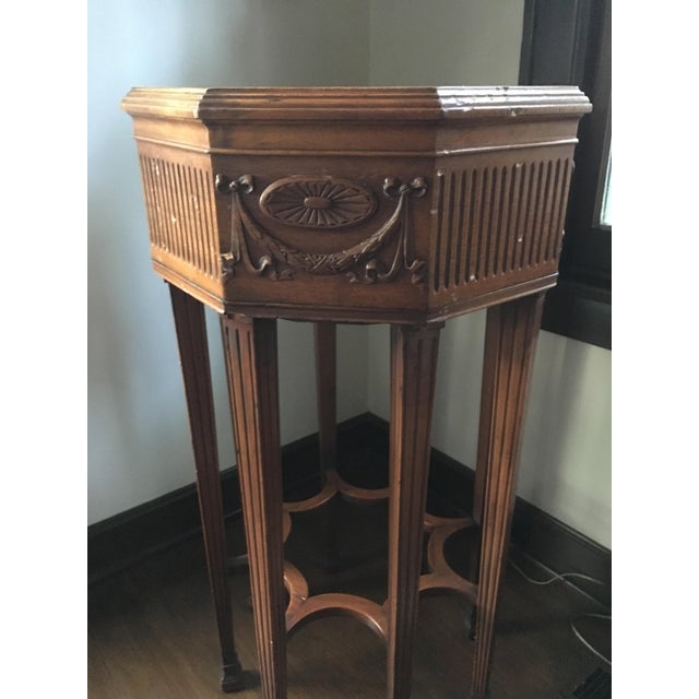 Old plant stand, condition fair. Dings and scrapes, see rim. Stable and beautiful 41" tall, 21.5" across the top.