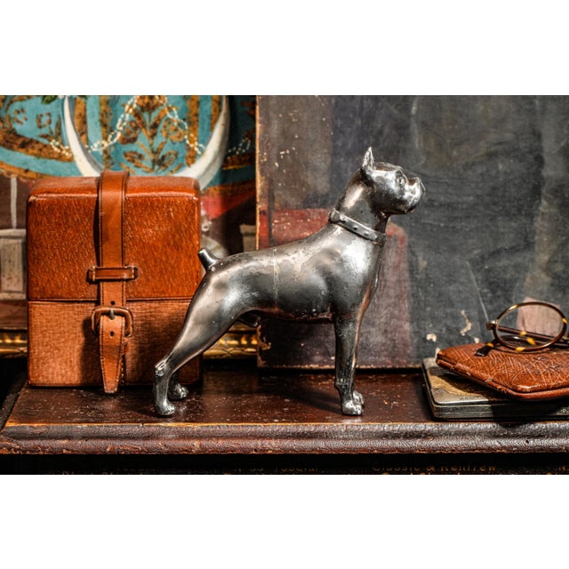 Bring timeless charm and character to your collection with this incredible antique Jennings Brothers Boxer dog statue....