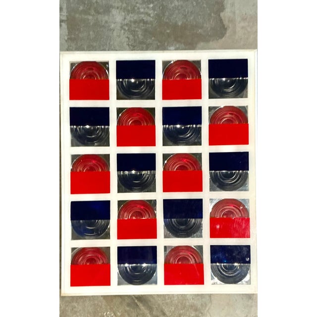 This vintage geometric wall art piece brings a crisp Mid-Century Modern presence to an interior, combining a white-painted...
