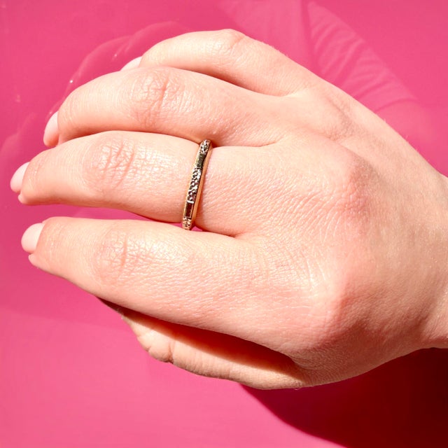 About This Ring: A timeless wedding band circa 1940s, lovingly preserved through the decades. Delicate orange blossom...