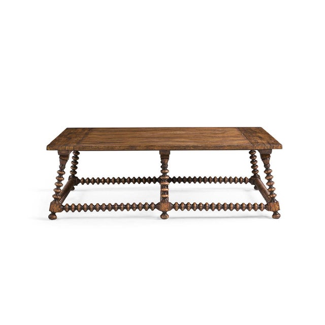 The Cocktail Table stands out with its sculptural texture and old-world charm. Its large rectangular top, finished in a...