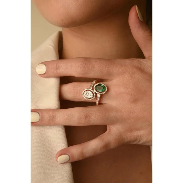 This is part of Chairish’s Fine Jewelry assortment. This Modern Toi Et Moi Diamond and Emerald Ring in 18K Gold featuring...
