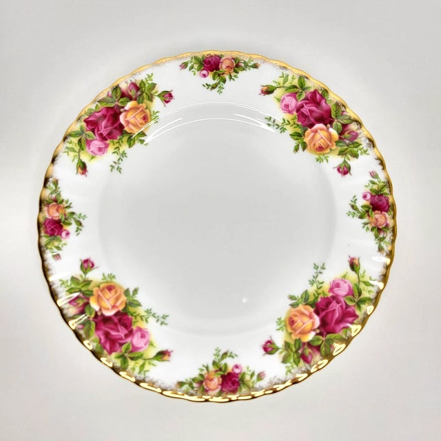 Add timeless English elegance to your table with this beautiful **set of Seven Vintage Royal Albert Old Country Roses...