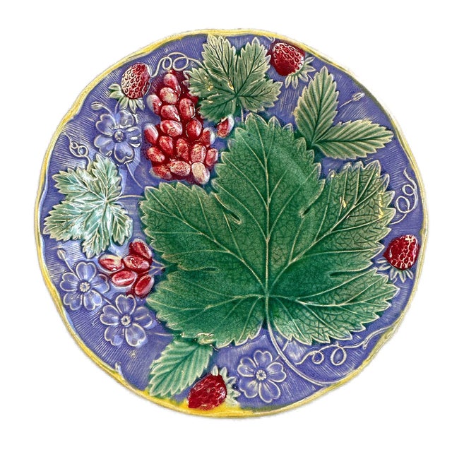 This is a late 19th Century English Wedgwood Grape Leaf and Strawberry pattern. This is a beautiful lavender ground plate...
