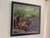 The artwork depicts a reclining figure adorned with antlers, evoking a sense of myth and nature intertwined. The soft,...