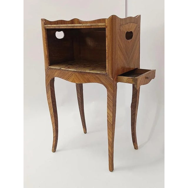Original Louis XV side table at the end of the 18th century, with original Brech d´Alep marble slabs and a drawer on the...