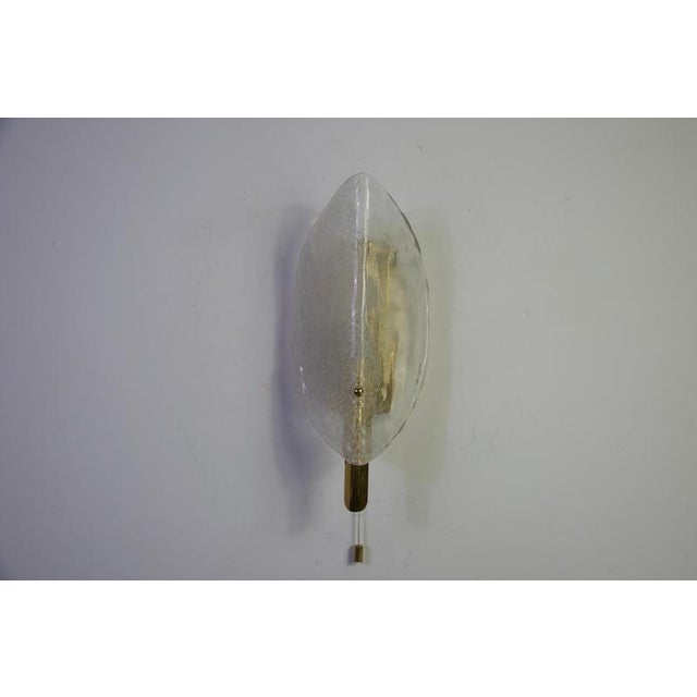 Brass and ice glass wall lamp by kalmar franken, austria, 1960s. This elegant vintage wall light features a sculptural...