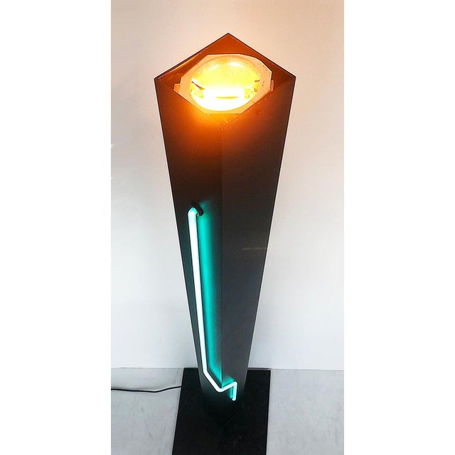 Postmodern Rudi Stern Torchiere Lamp "Let There Be Neon" Offered for sale is a black postmodern Rudi Stern neon aluminum...