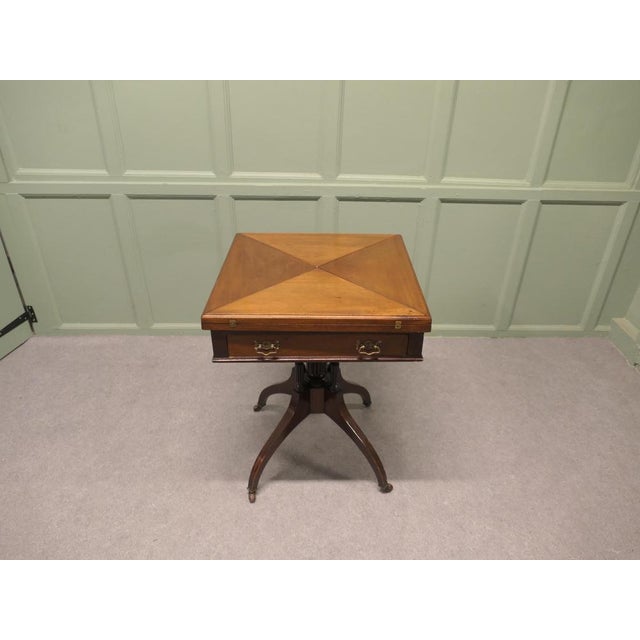 A beautifully designed piece, the sturdy 4 footed leg supports the 4 triangular hinged leaves which swivel and by pressing...