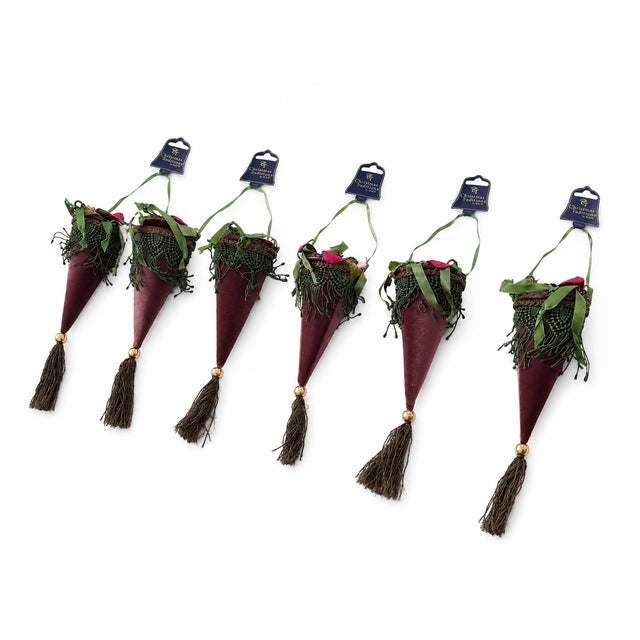 An elegant set of six Christmas Traditions by Aldik designer ornaments featuring a sophisticated muted mauve-purple...