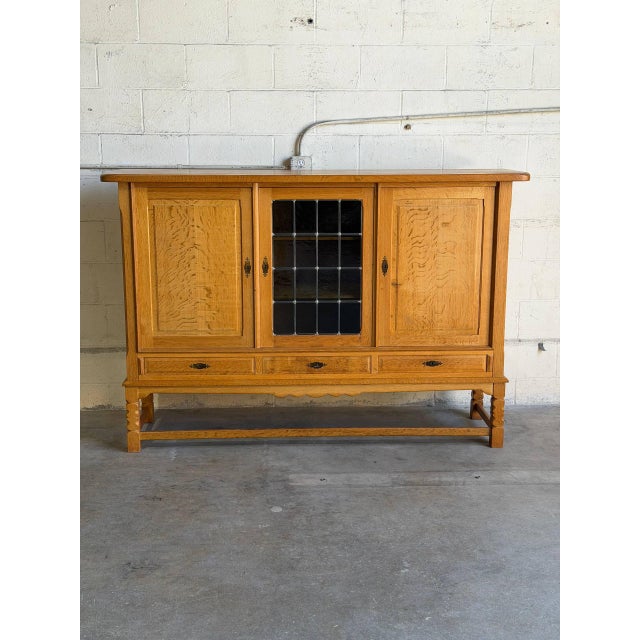 Beautiful vintage Danish oak cabinet by Stilmobler featuring clean Scandinavian lines, sculpted solid oak details, and an...