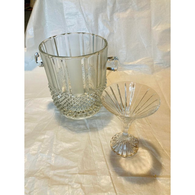 Beautiful large and heavy crystal ice bucket. They really stunning in person very contemporary and elegant.